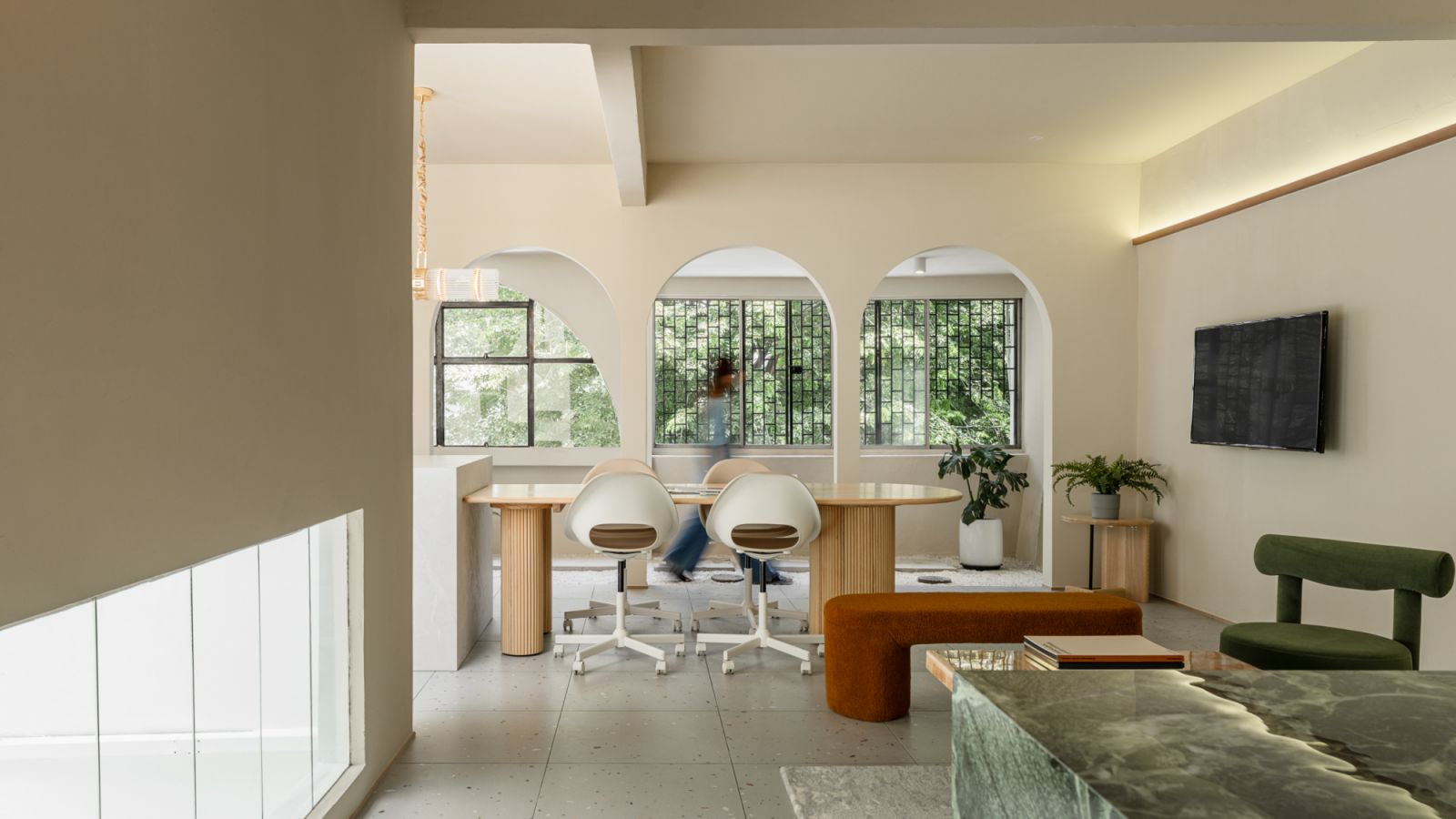 Curved detailing and furniture add softness to the office