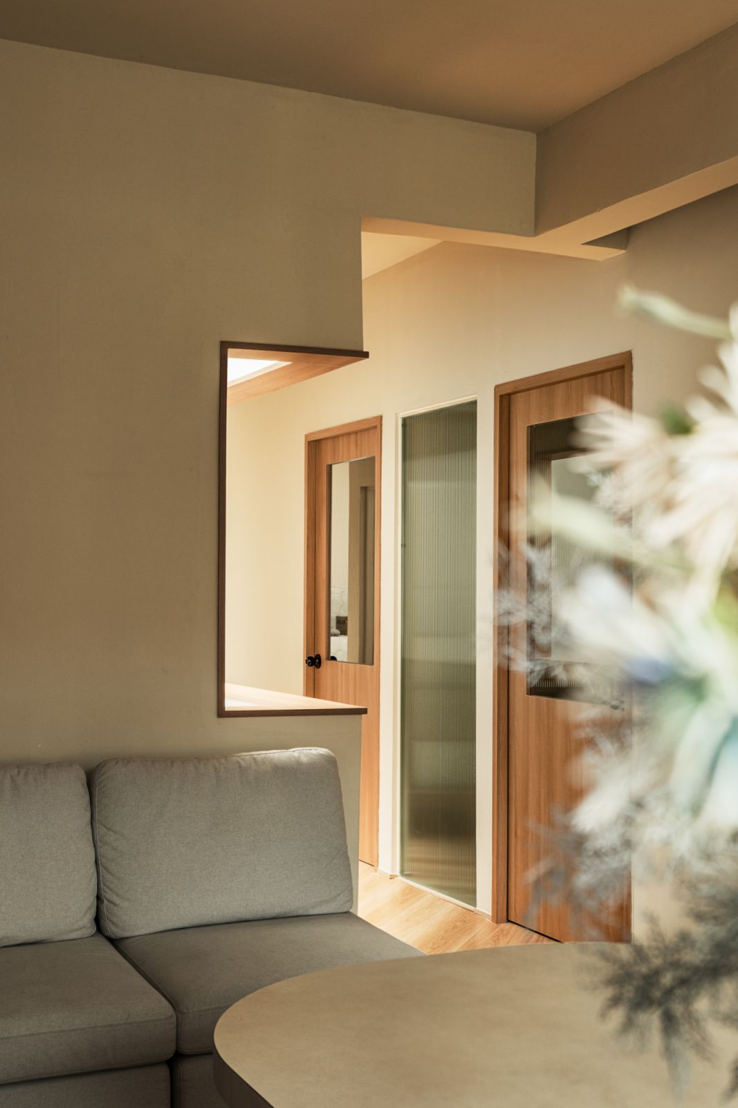 A cosy seating area highlighting the studio’s warm material palette
