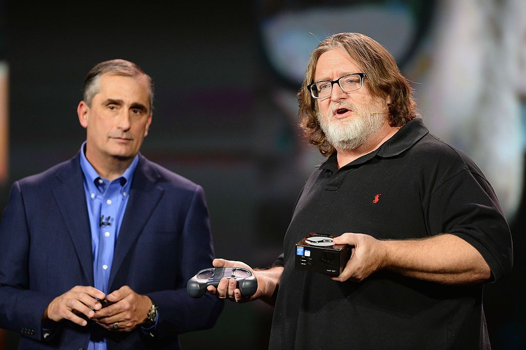 LAS VEGAS, NV - JANUARY 06: Intel Corp. CEO Brian Krzanich (L) looks on as Gabe Newell, co-founder of video game developer and distributor Valve, speaks during Krzanich's keynote address at the 2014 International CES at The Venetian Las Vegas on January 6, 2014 in Las Vegas, Nevada. CES, the world's largest annual consumer technology trade show, runs from January 7-10 and is expected to feature 3,200 exhibitors showing off their latest products and services to about 150,000 attendees. (Photo by Ethan Mill