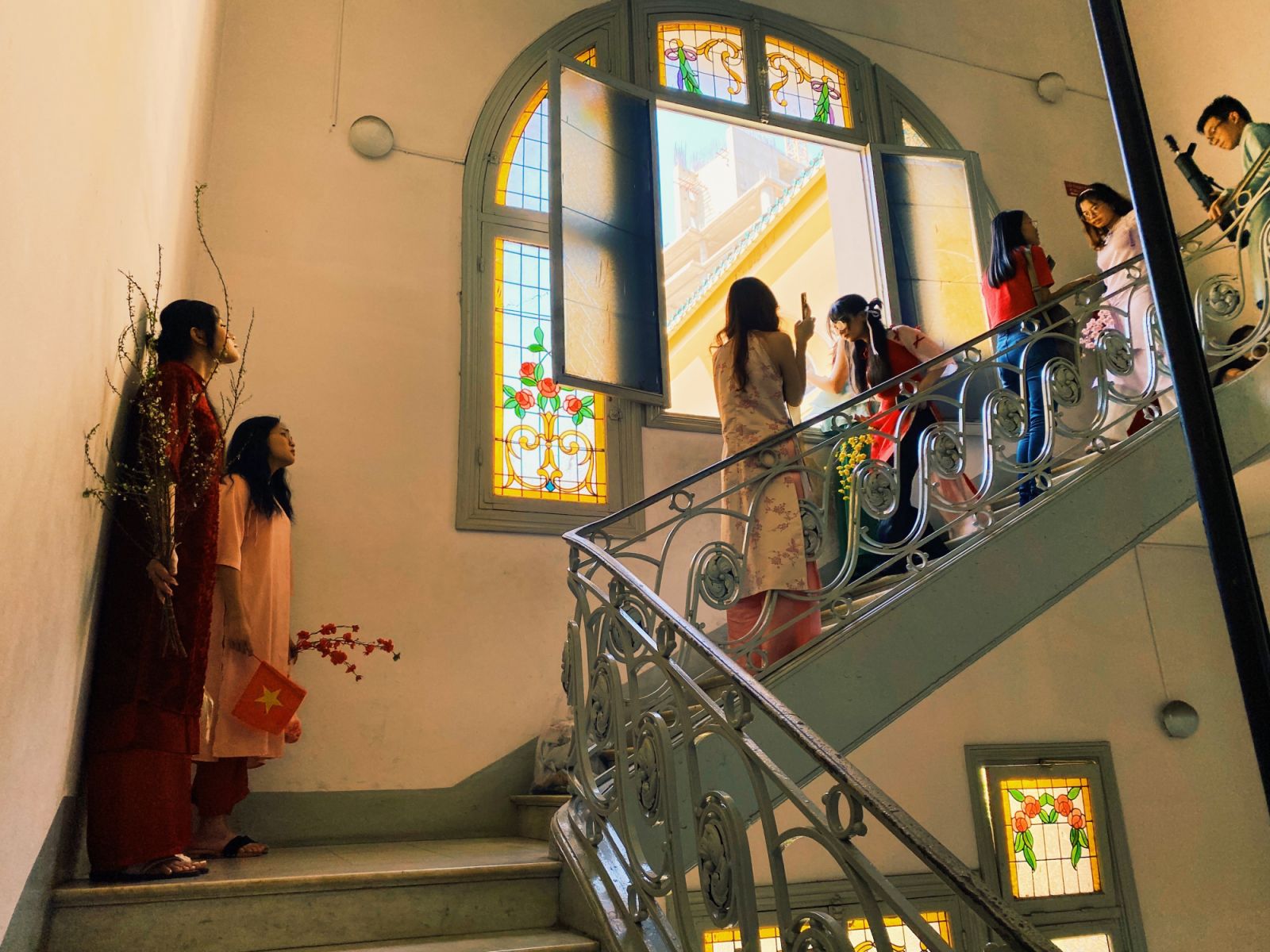 Vietnamese locals take photos inside the Museum of Fine Arts in Ho Chi Minh (Photo: Jove Moya)