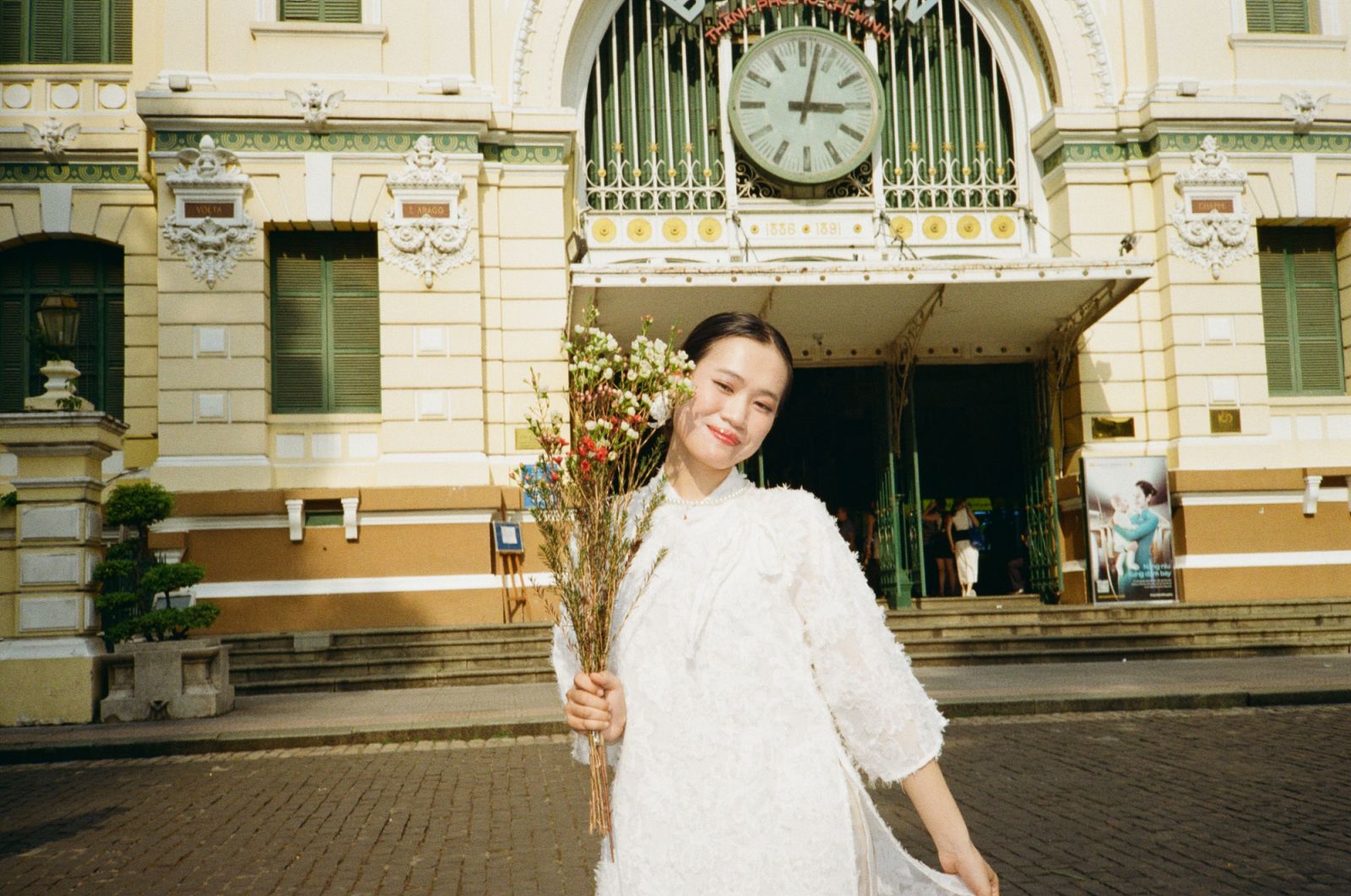 A Vietnamese local in front of Saigon Central Post Office in Ho Chi Minh City (Photo: Jove Moya)