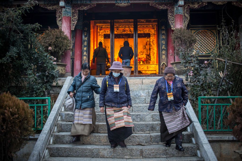 SHANGRI-LA, YUNNAN, CHINA - 2017/11/28: Tibetan woman seen going down the steps at the Tibetan Temple 'Guishan' at the Turtle Mountain Park in Shangri-La. (Photo by Guillaume Payen/SOPA Images/LightRocket via Getty Images)