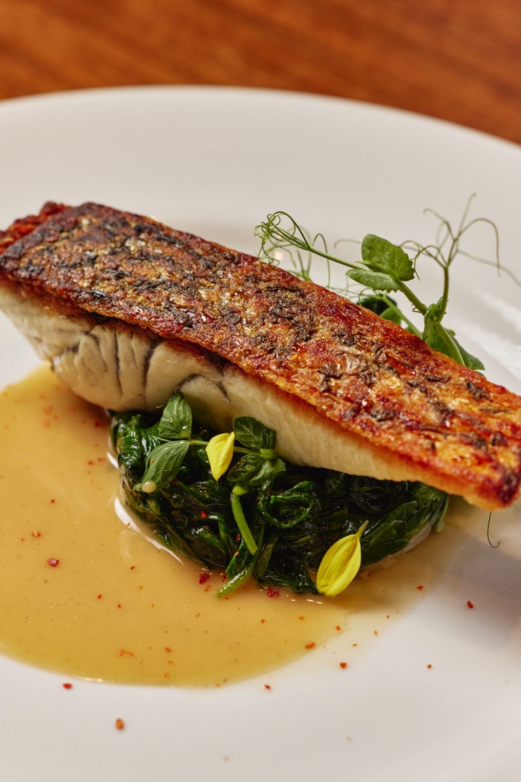Sautéed barramundi, Martell VSOP beurre blanc by Wolfgang's Steakhouse | Photo by JV Rabano