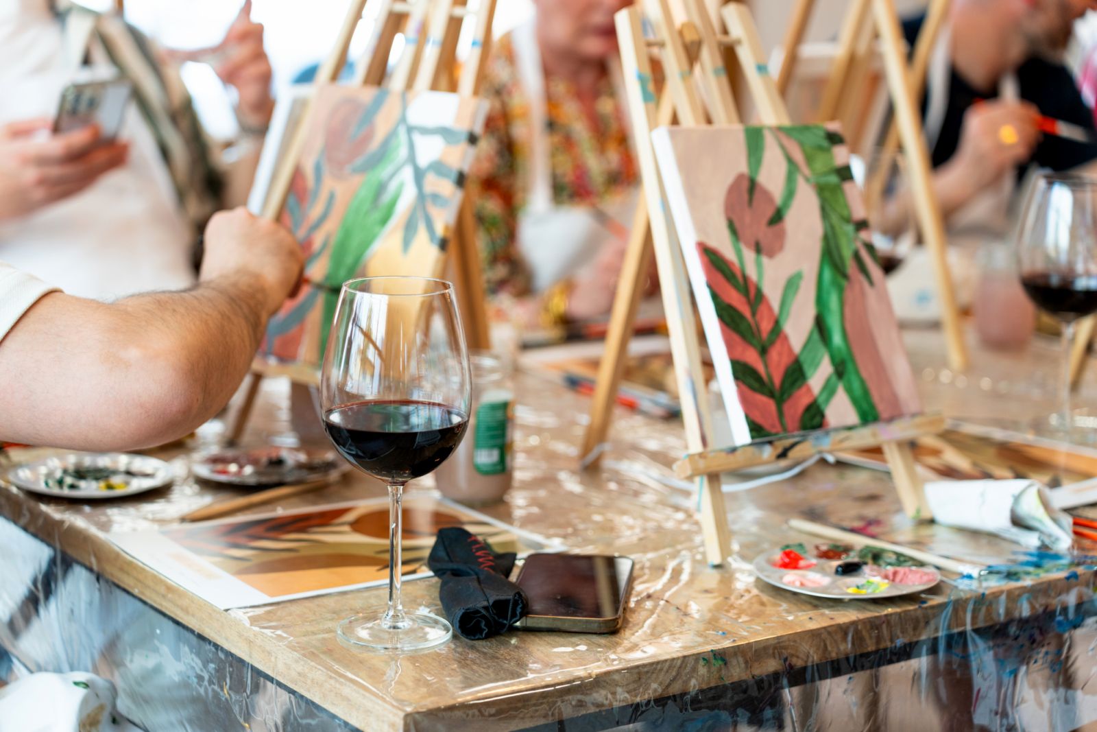 Spend Galentine's Day painting and sipping wine with your friends (Photo: Getty Images)