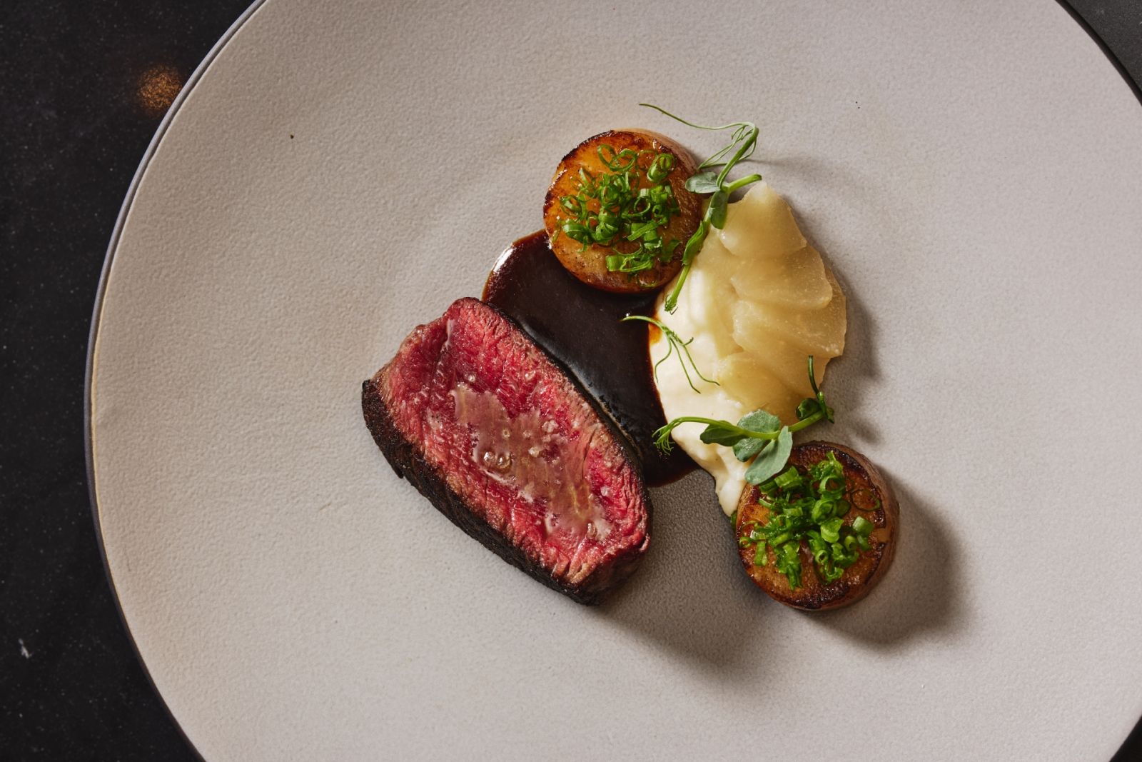 Tenderloin with Martell VSOP demi-glace, celeriac purée, potato fondant, confit pear by Cantabria | Photo by JV Rabano