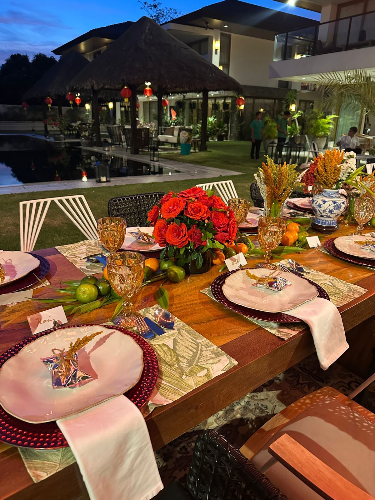 Details of Tanya Moreno De La Paz's tablescape with fresh flowers and tropical placemats at her Valentine's Day celebration