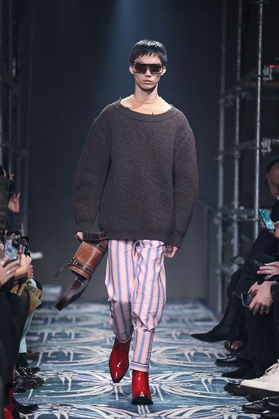 MILAN, ITALY - JANUARY 19: A model walks the runway at the Prada fashion show during the Milan Menswear Fall/Winter 2025 - 2026 Fashion Week on January 19, 2025 in Milan, Italy. (Photo by Daniele Venturelli/WireImage)