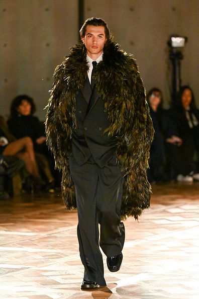 PARIS, FRANCE - JANUARY 28: (EDITORIAL USE ONLY - For Non-Editorial use please seek approval from Fashion House and if La Bourse de Commerce appears on the image please credit © Tadao Ando Architect & Associates, Niney et Marca Architectes, agence Pierre-Antoine Gatier) A model walks the runway during the Saint Laurent Menswear Fall-Winter 2025/2026 show as part of Paris Fashion Week at La Bourse de Commerce - Pinault Collection  on January 28, 2025 in Paris, France. (Photo by Stephane Cardinale - Corbis/Co