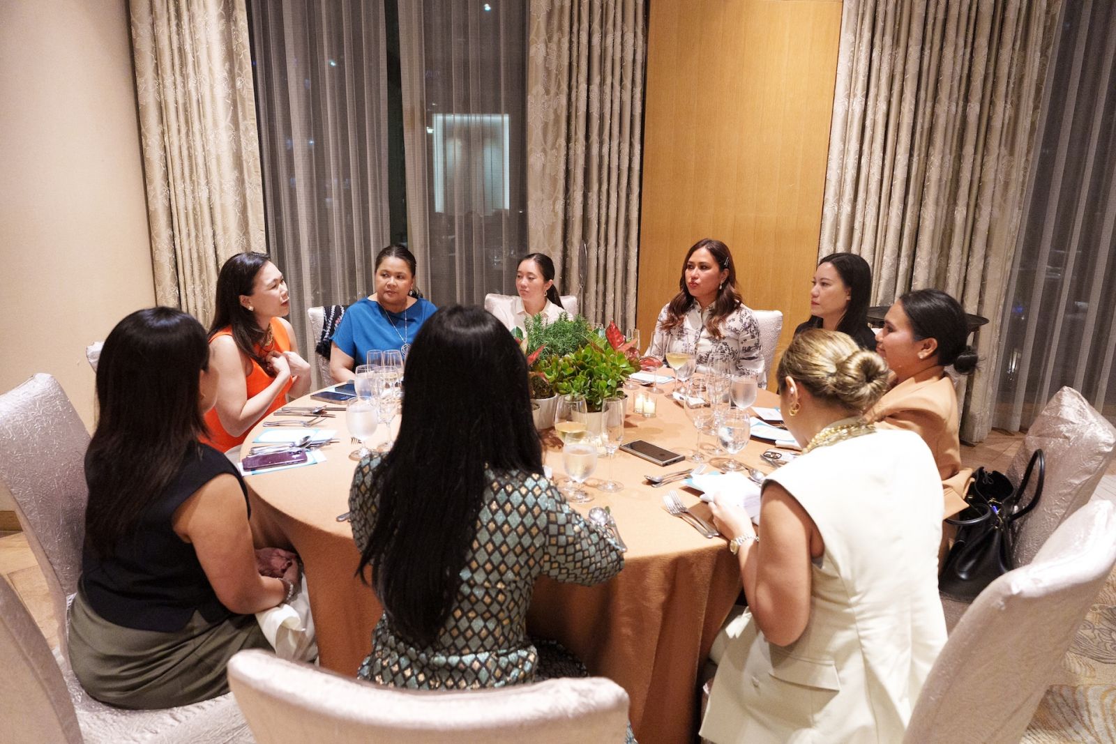 Guests having a spirited discussion at dinner