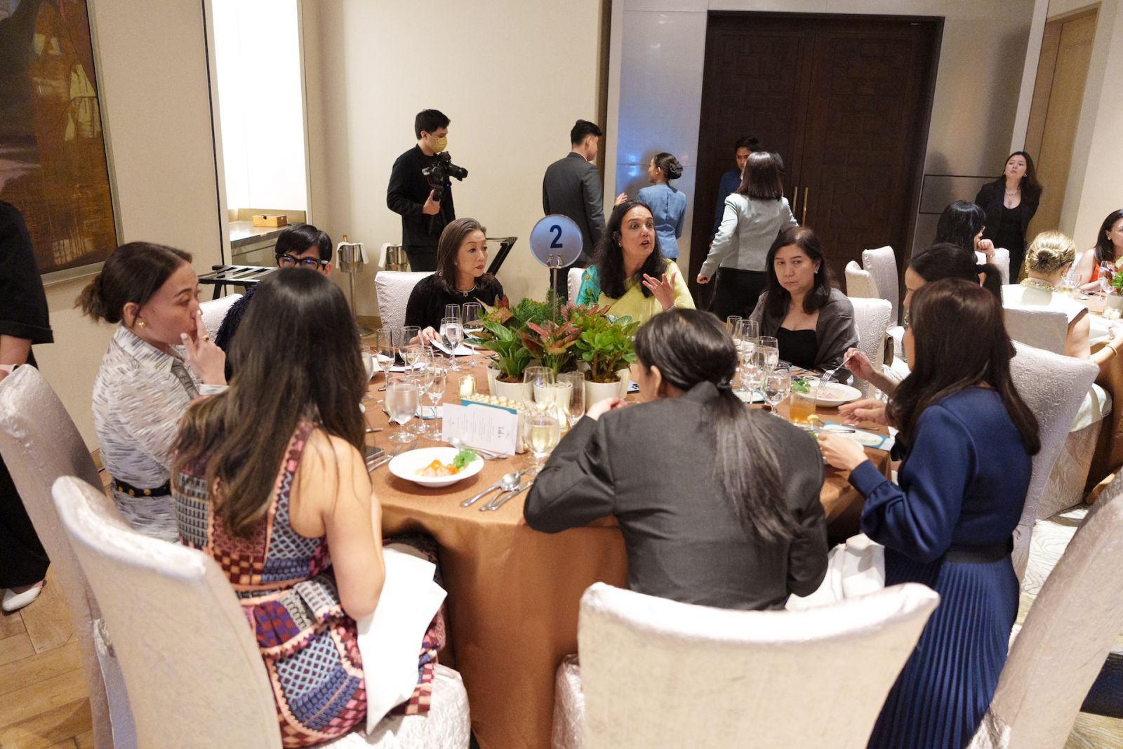 Guests having a spirited discussion at dinner