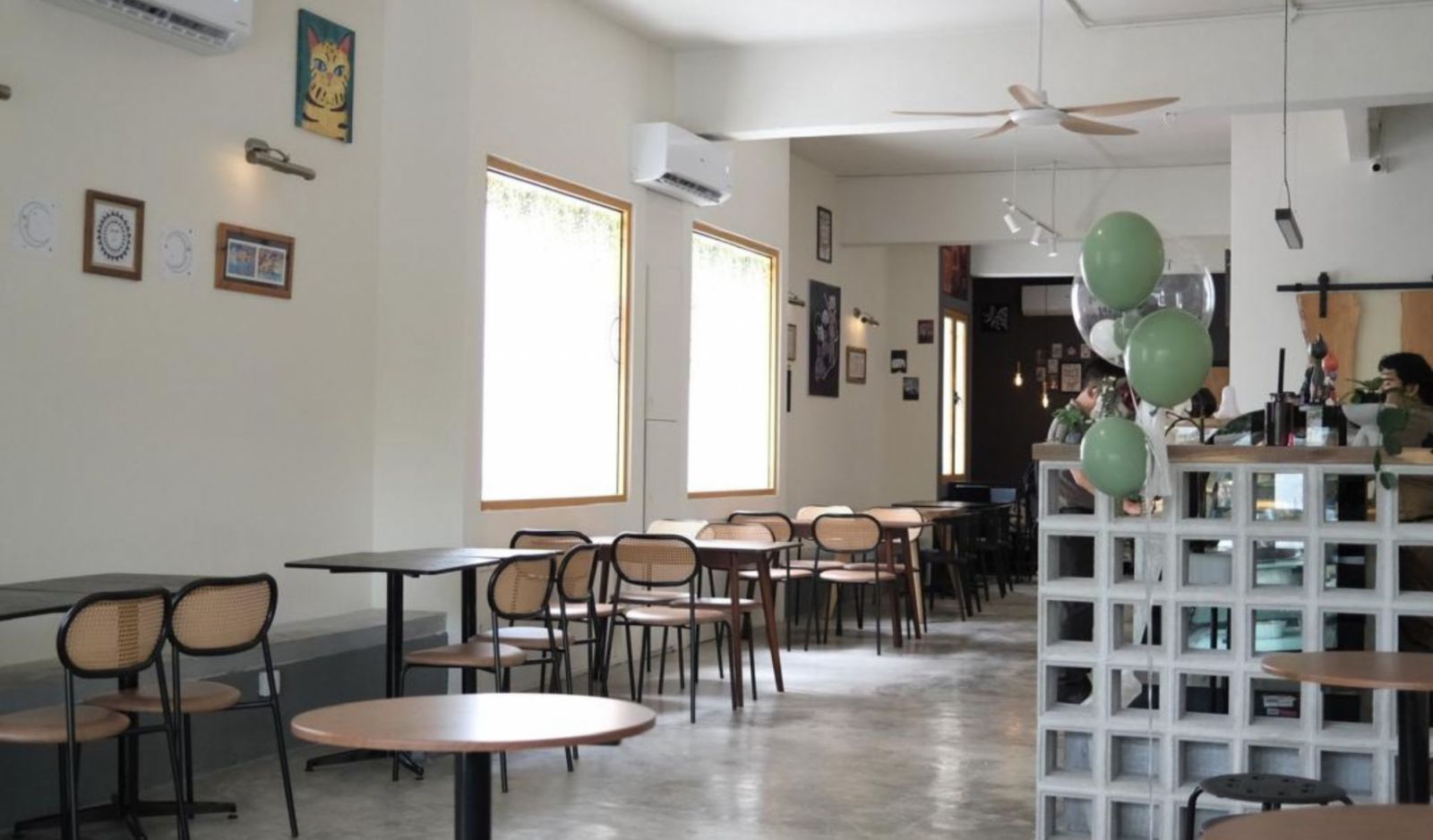 The cosy and minimalist interior of Nibbles Café, designed to create a welcoming and open space for customers to be themselves and connect with like-minded individuals