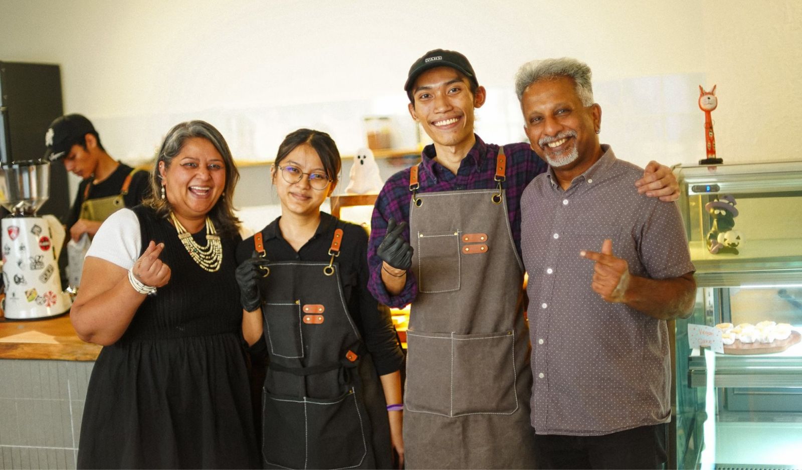 Wan Muhammad Bin Wan Sa’adi with his fellow founder Mysara Elysha, together with their bakery collaborators who own a family-run business, with whom they connected during their studies. This partnership now supplies Nibbles Café with freshly baked pastries, cookies, and cakes