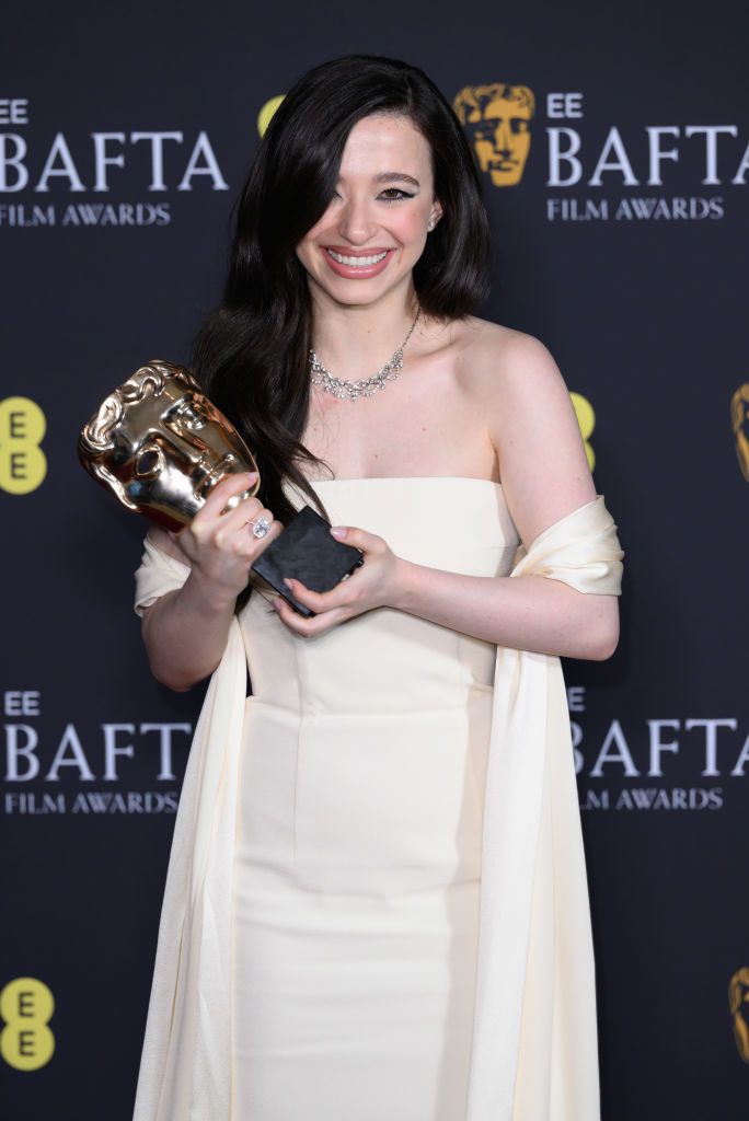 LONDON, ENGLAND - FEBRUARY 16: Mikey Madison poses with the Leading Actress Award for 'Anora' in the winners room during the 2025 EE BAFTA Film Awards at The Royal Festival Hall on February 16, 2025 in London, England. (Photo by Karwai Tang/WireImage)