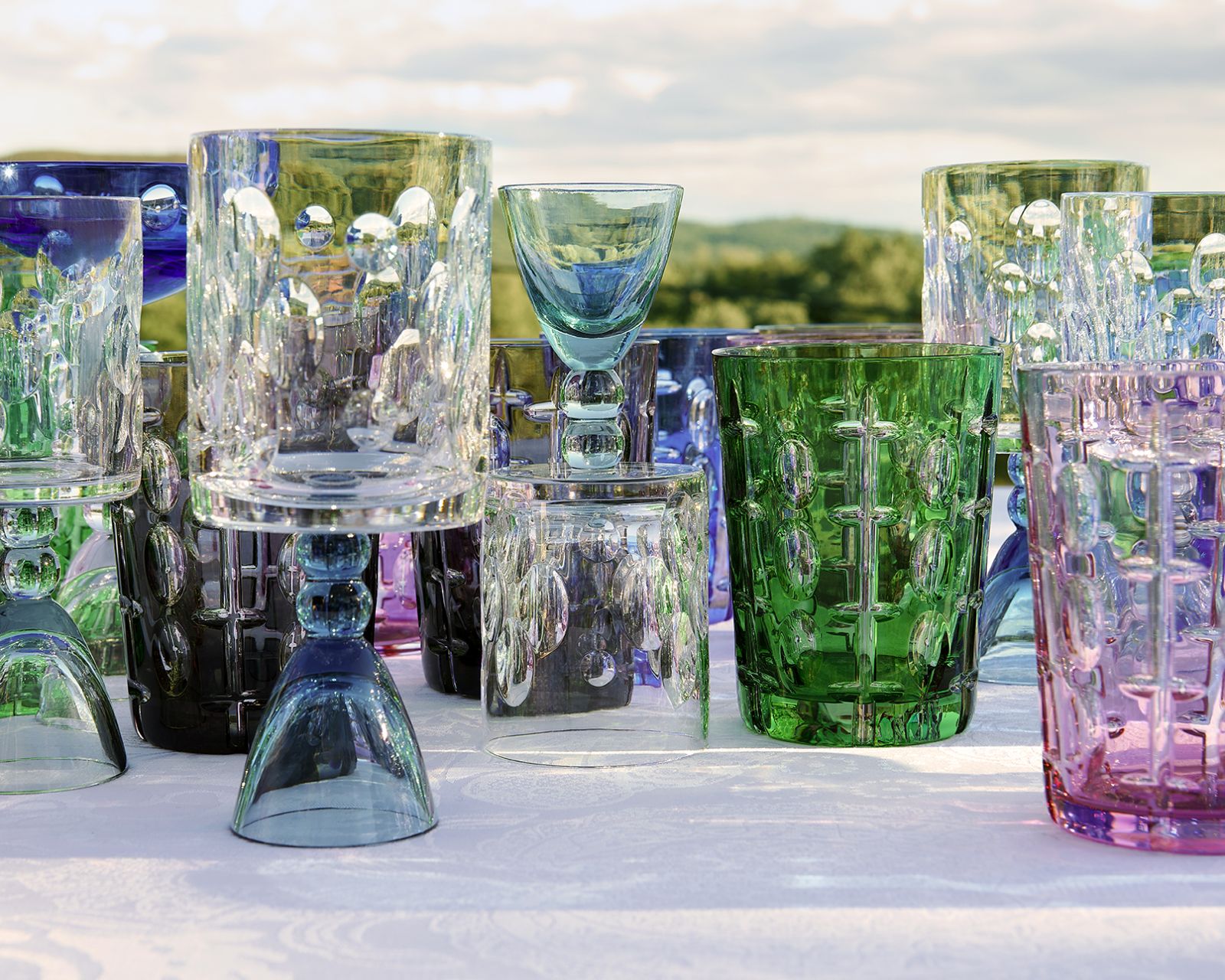 The Rêve de Cristal collection features versatile glasses with distinctive cross-and-oval patterns