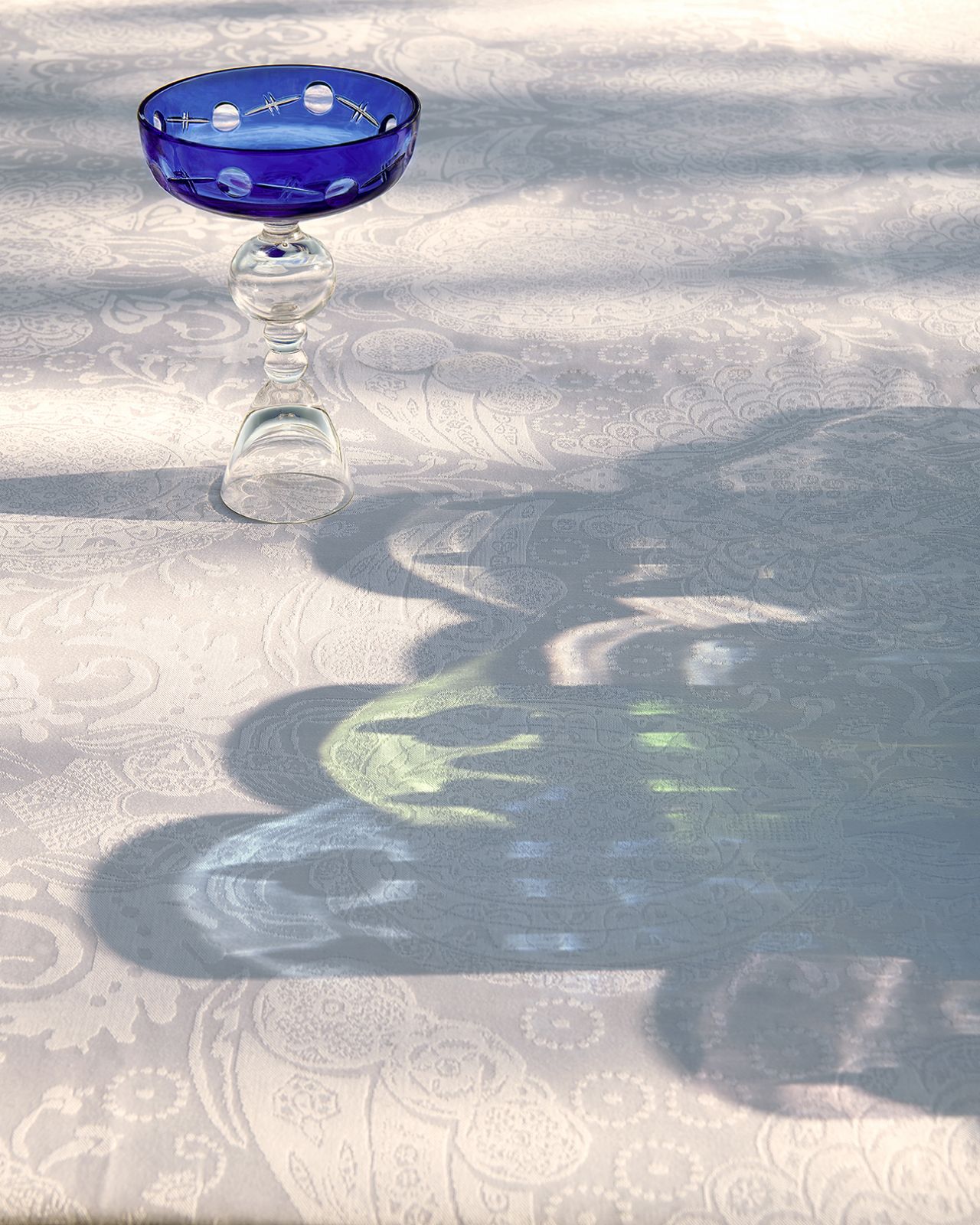 Light refracts through the cobalt-blue crystal