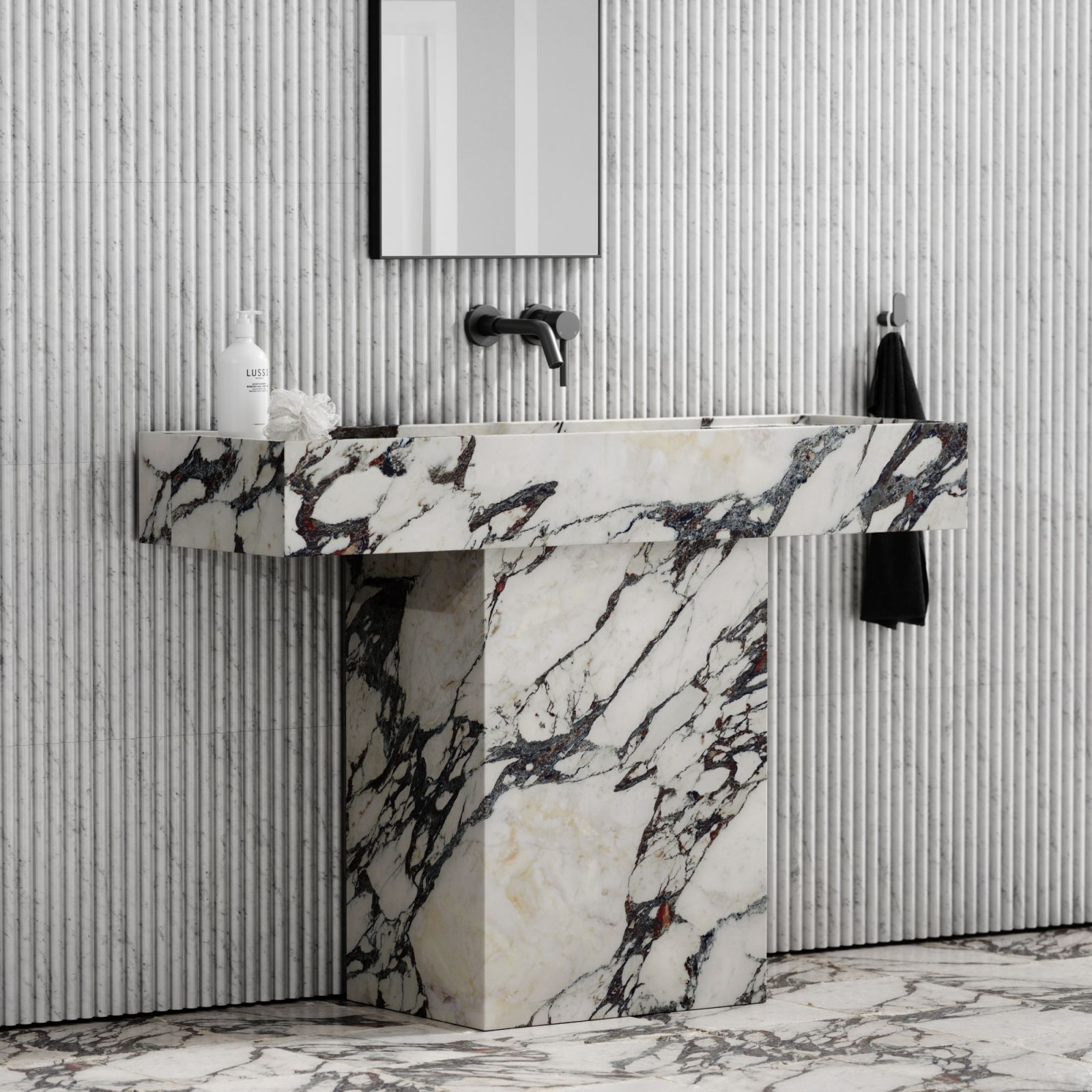 A Calacatta Viola pedestal basin with distinctive dark veining (Photo: Lusso)