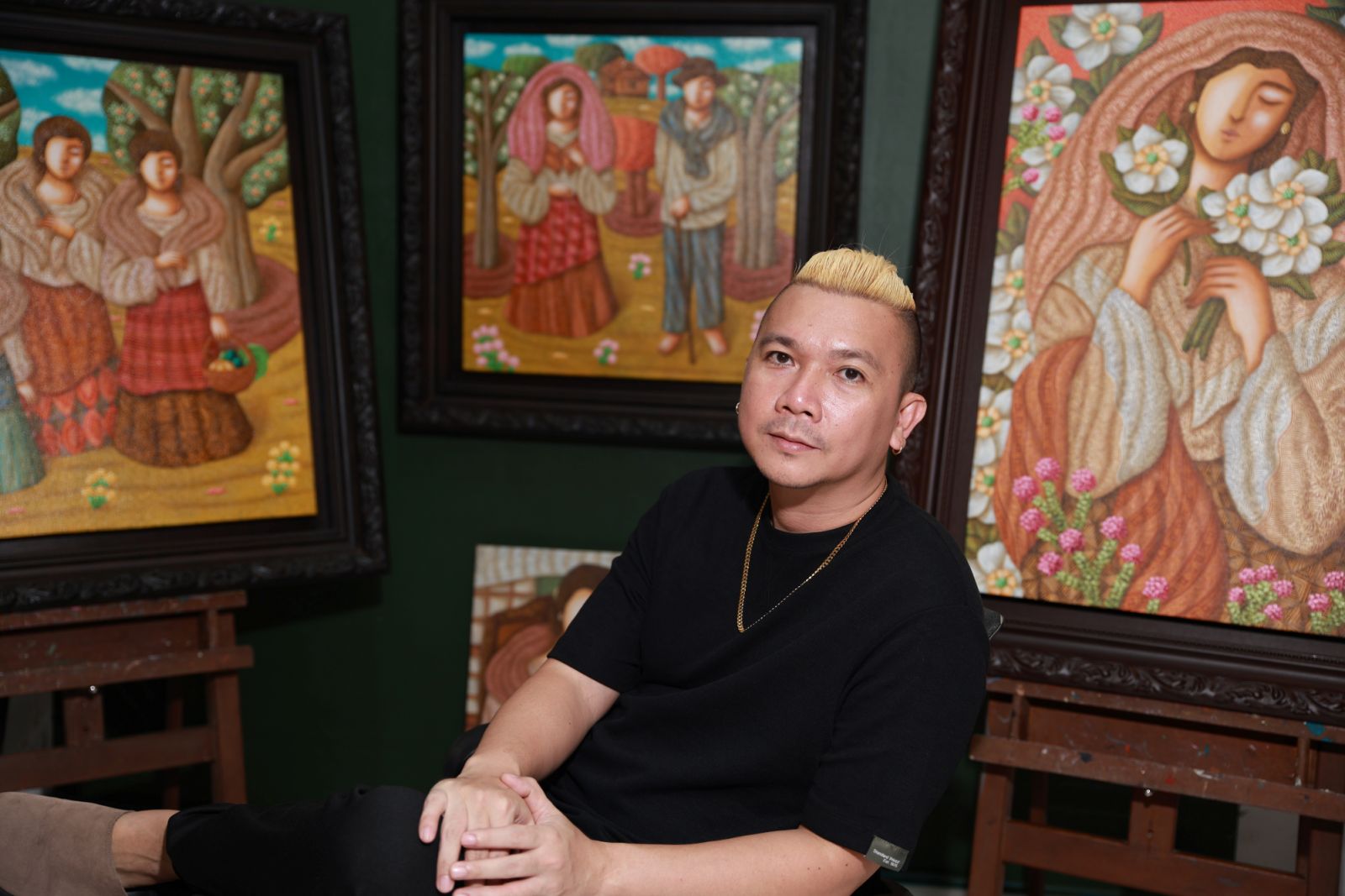 Contemporary artist, Francis Nacion in front of his works (Photo courtesy of Francis Nacion)