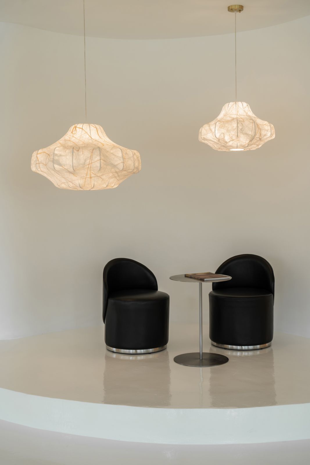 A closer view of the Pulp lights, displayed above a modern seating nook