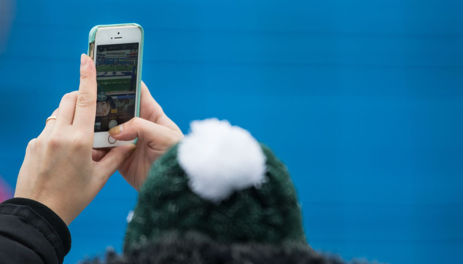 ORCHARD PARK, NY - JANUARY 03: A New York Jets fan takes a selfie with her iphone before the game against the Buffalo Bills on January 3, 2016 at Ralph Wilson Stadium in Orchard Park, New York. Buffalo Bills defeat New York Jets 22-17. (Photo by Brett Carlsen/Getty Images) *** Local Caption ***