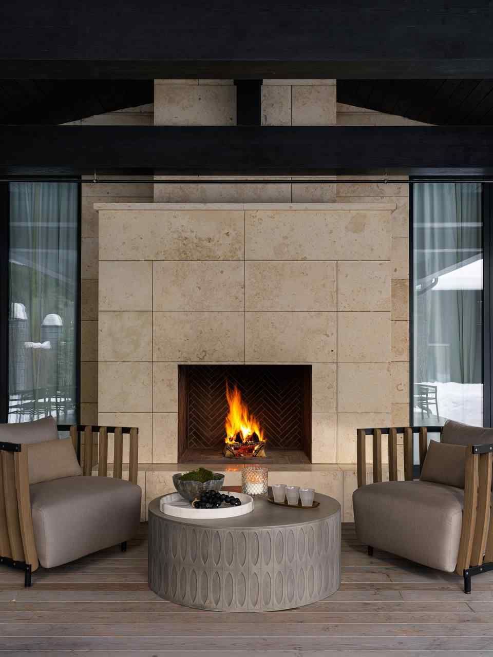 The spacious outdoor patio with a large fireplace