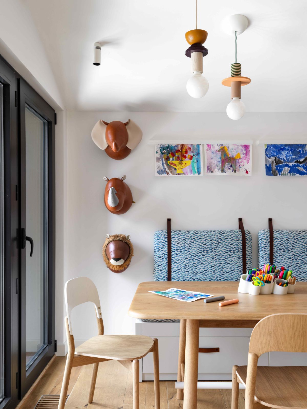 Embellished with quirky light fixtures and vibrant wall decors