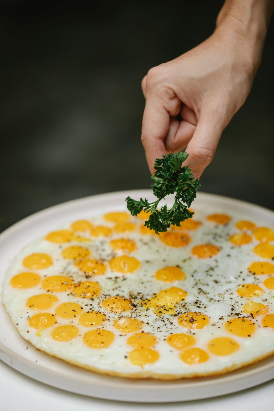 Photo by Klaus Nielsen: https://www.pexels.com/photo/crop-unrecognizable-chef-adding-fresh-herb-on-fried-quail-eggs-6294351/