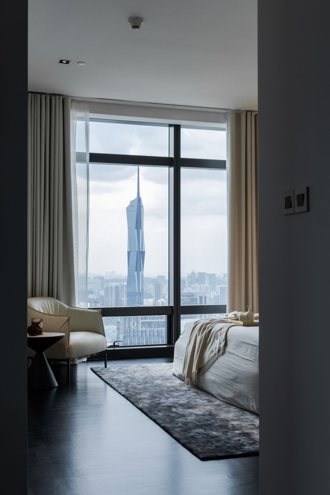 The bedroom offers panoramic views of the Merdeka 118 tower