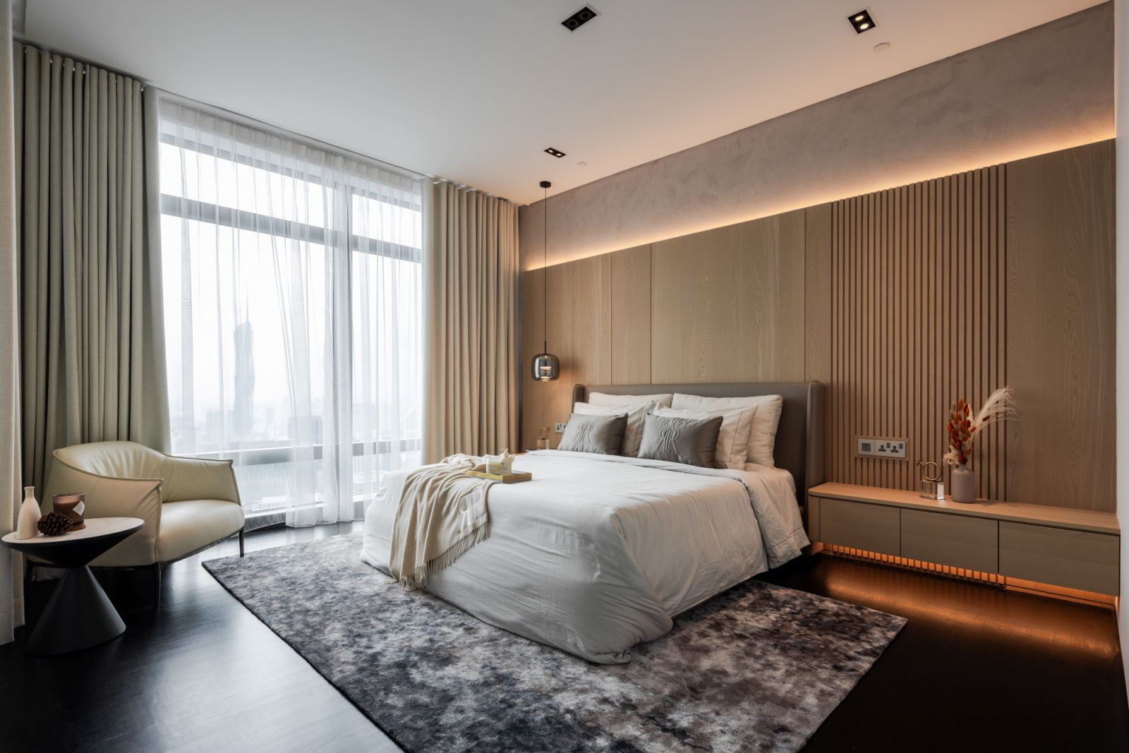Bedrooms offer a welcoming retreat complemented by ambient wall lighting