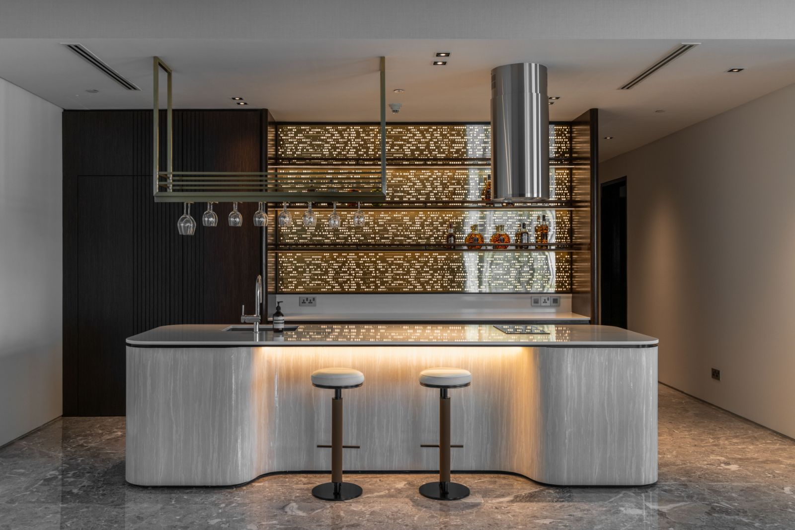 The contemporary kitchen bar serves as a sophisticated entertaining hub