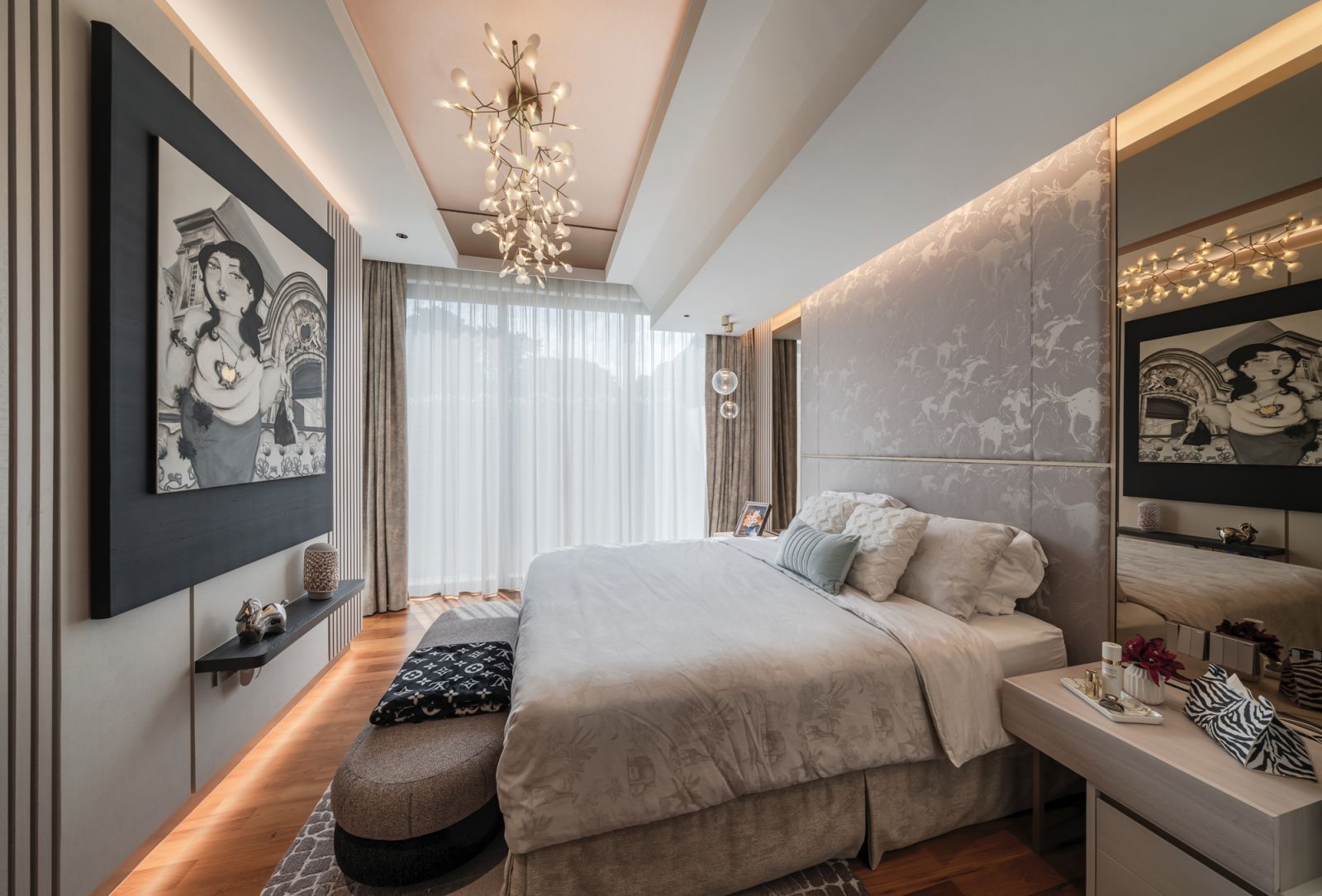 This sumptuous bedroom is given a lift by classy neutral hues and an ethereal glow afforded by the cove lighting that washes down from the top of the patterned headboard at night