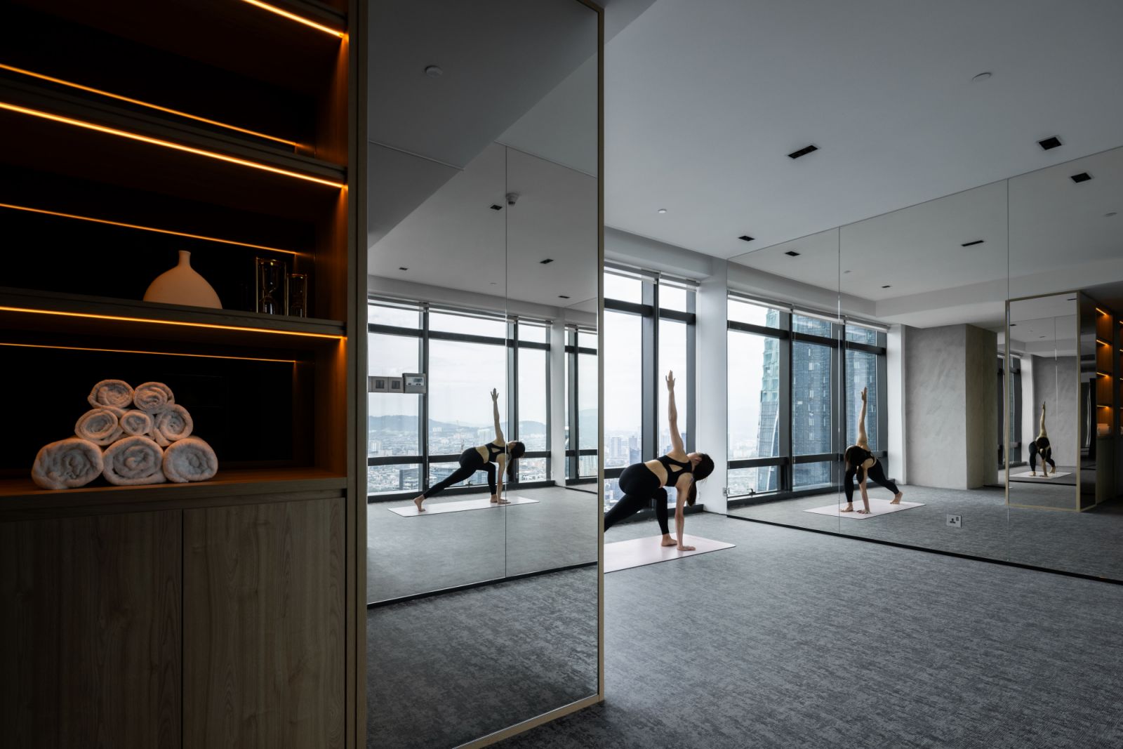 Mirrored walls and textured Suzuka paint define the private gym