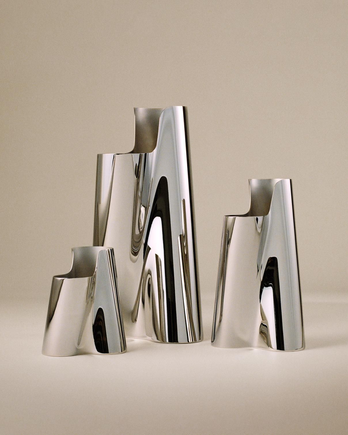 The complete Lituus collection features three sizes in mirror-polished stainless steel