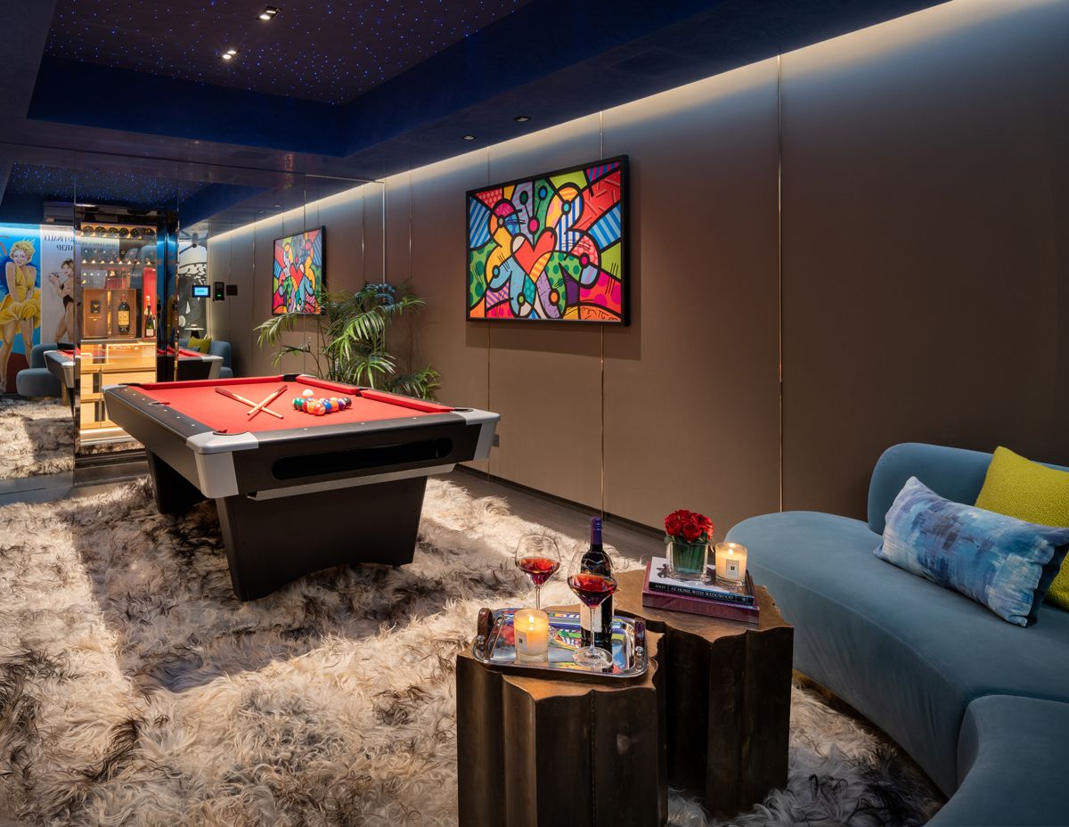 The basement has been turned into an entertainment hub, complete with a pool table, karaoke area and wine cellar
