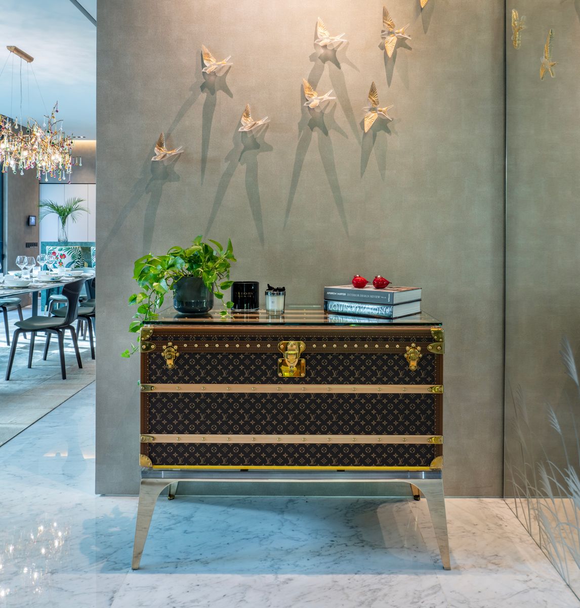 Gold and crystal wall sculptures from Lalique bring a sense of wonder to the entryway