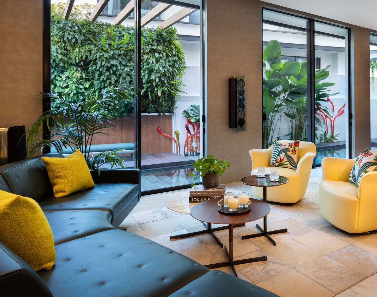 The living room looks out to a lush vertical garden which also acts as a privacy screen