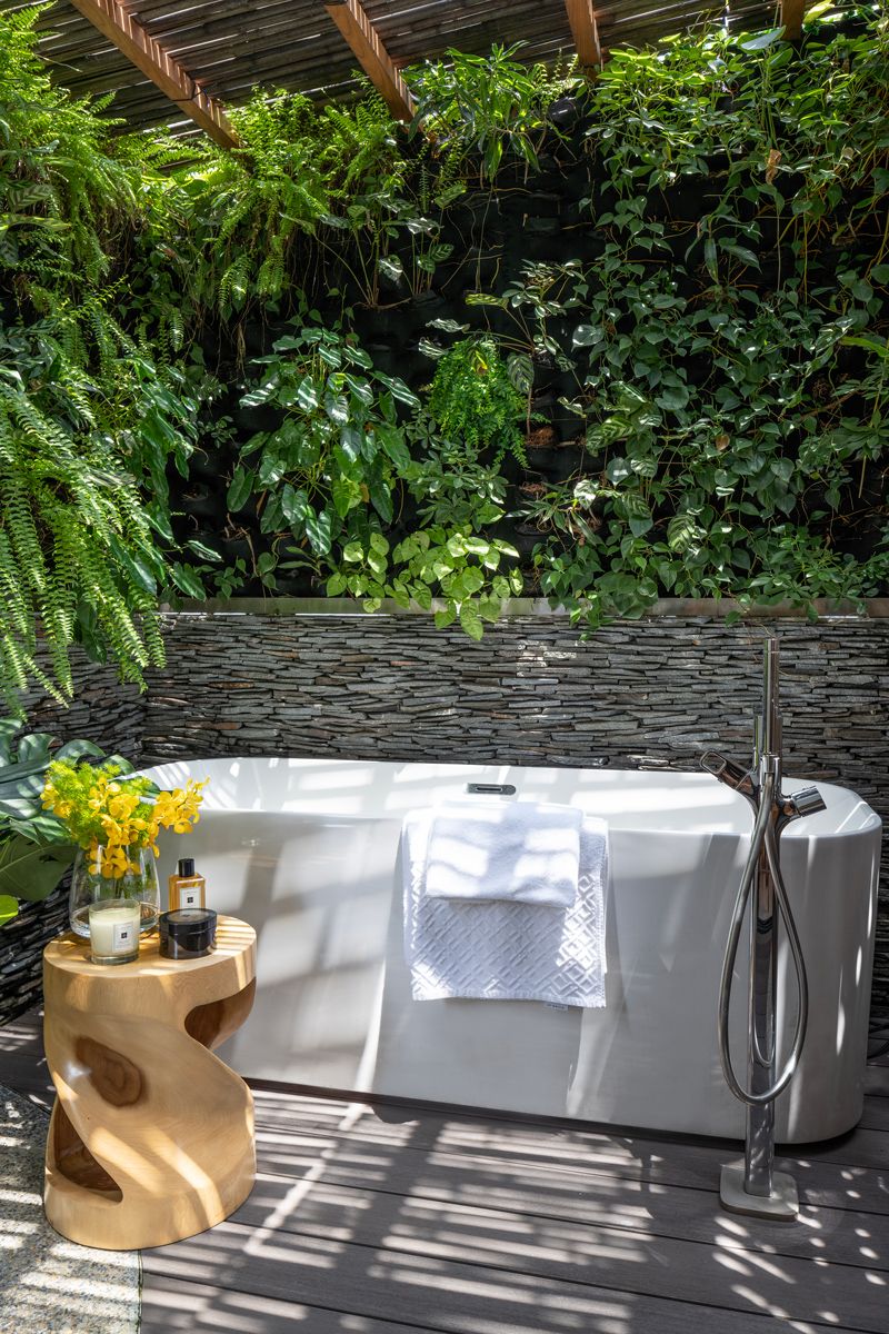 The stunning outdoor bath area is fitted with rust-proof hardware
