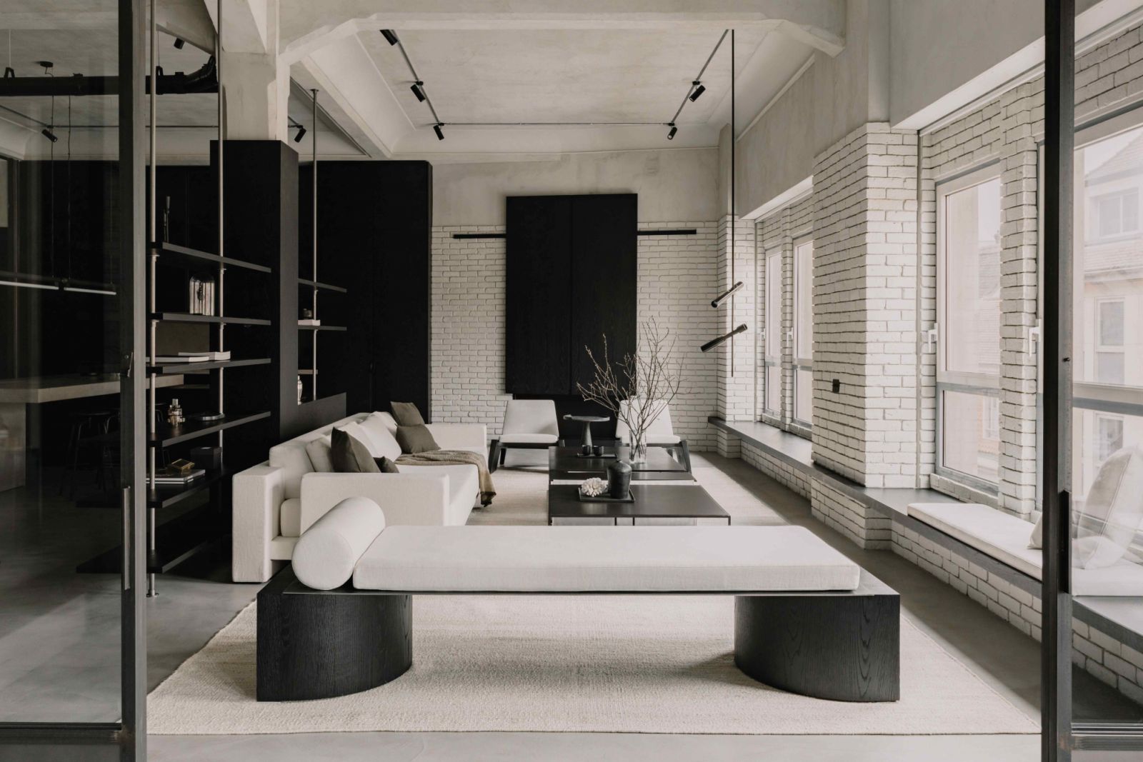 A blend of concrete and exposed brick walls reinforces the industrial aesthetic