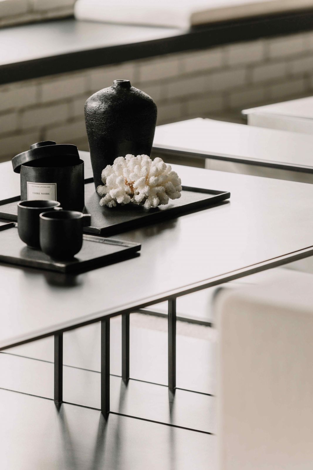 The design furniture pieces adhere to the overall industrial aesthetic