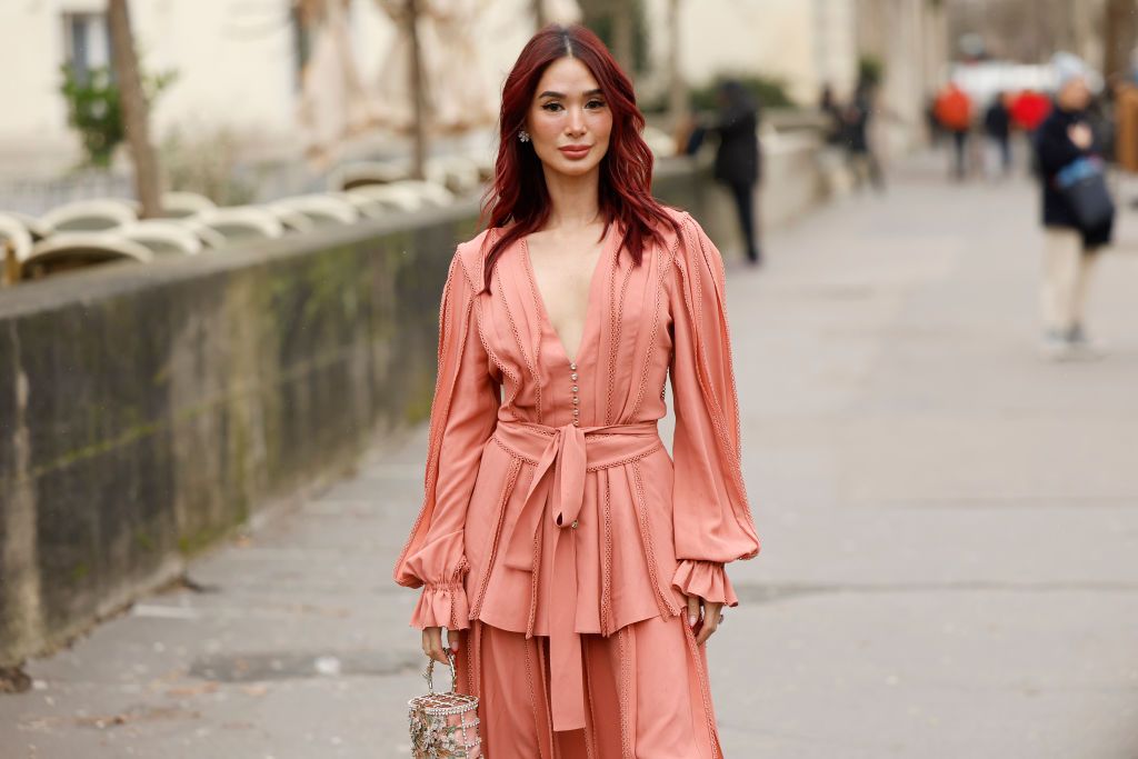 PARIS, FRANCE - JANUARY 29: Heart Evangelista wears a peach blouse with matching maxi skirt, crystal decorated bag, outside Elie Saab, during the Haute Couture Spring-Summer 2025 as part of Paris Fashion Week on January 29, 2025 in Paris, France. (Photo by Claudio Lavenia/Getty Images)