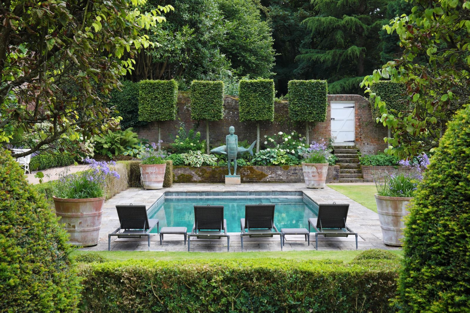 The garden and pool area of a Sussex, England home