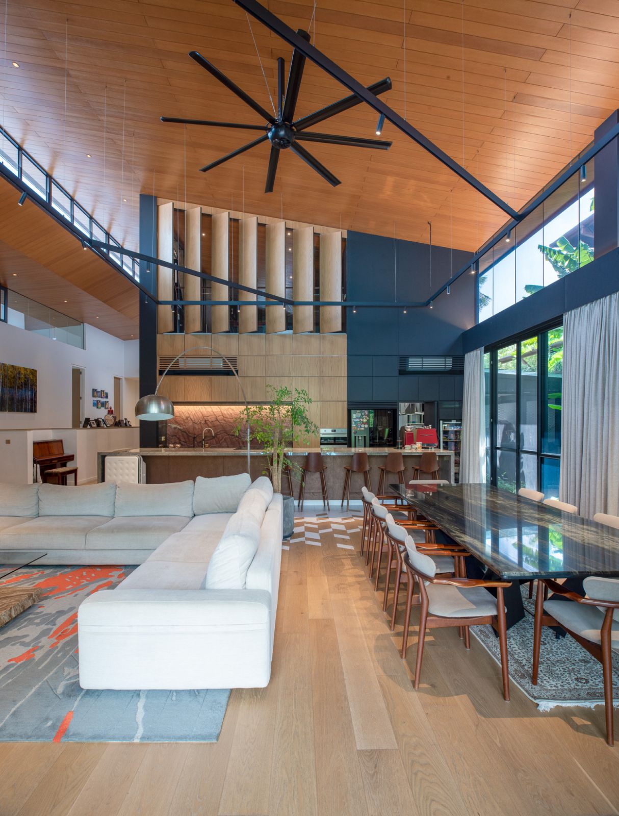 The sloping roof soars above the living room