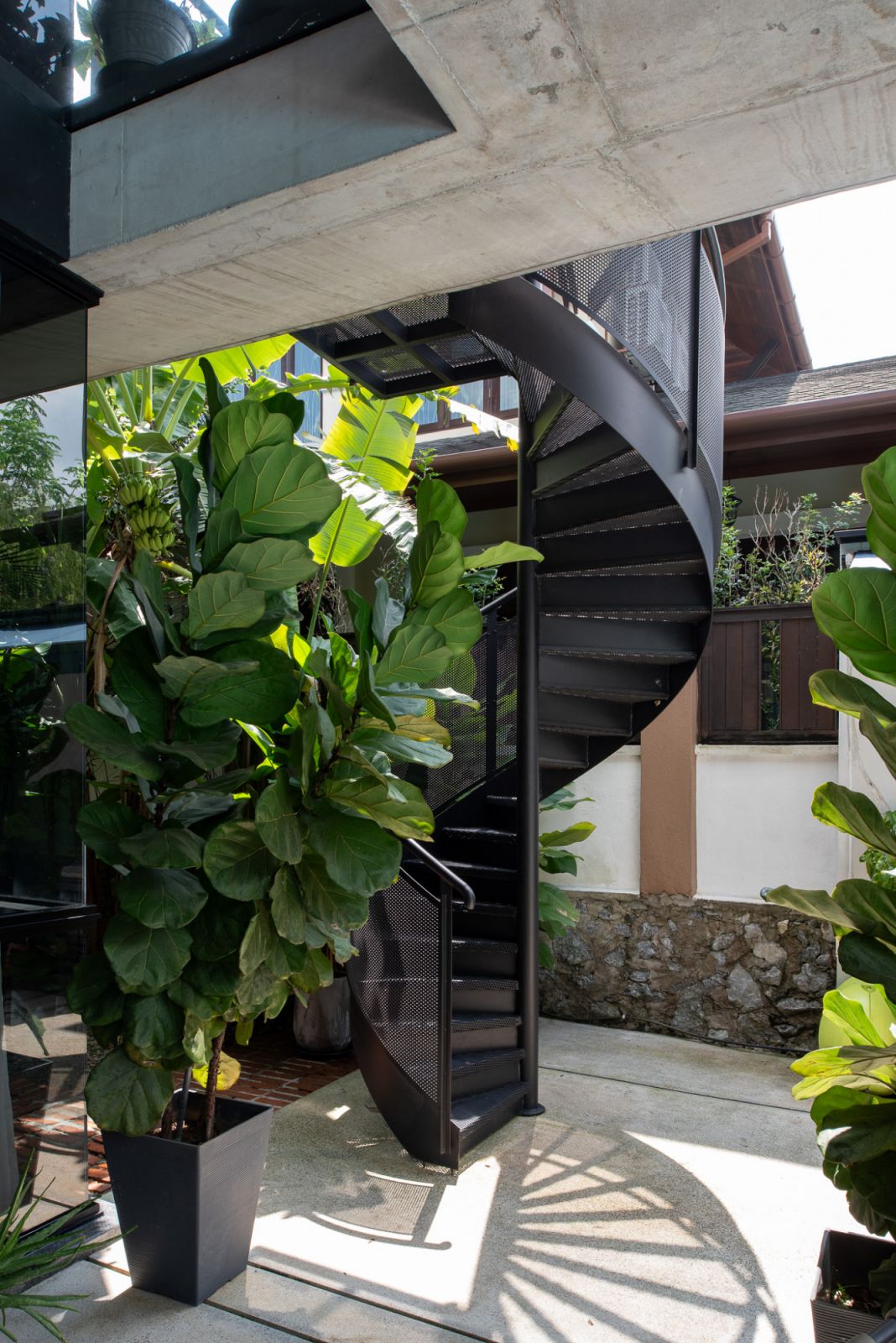 A spiral staircase leads up to the mezzanine floor
