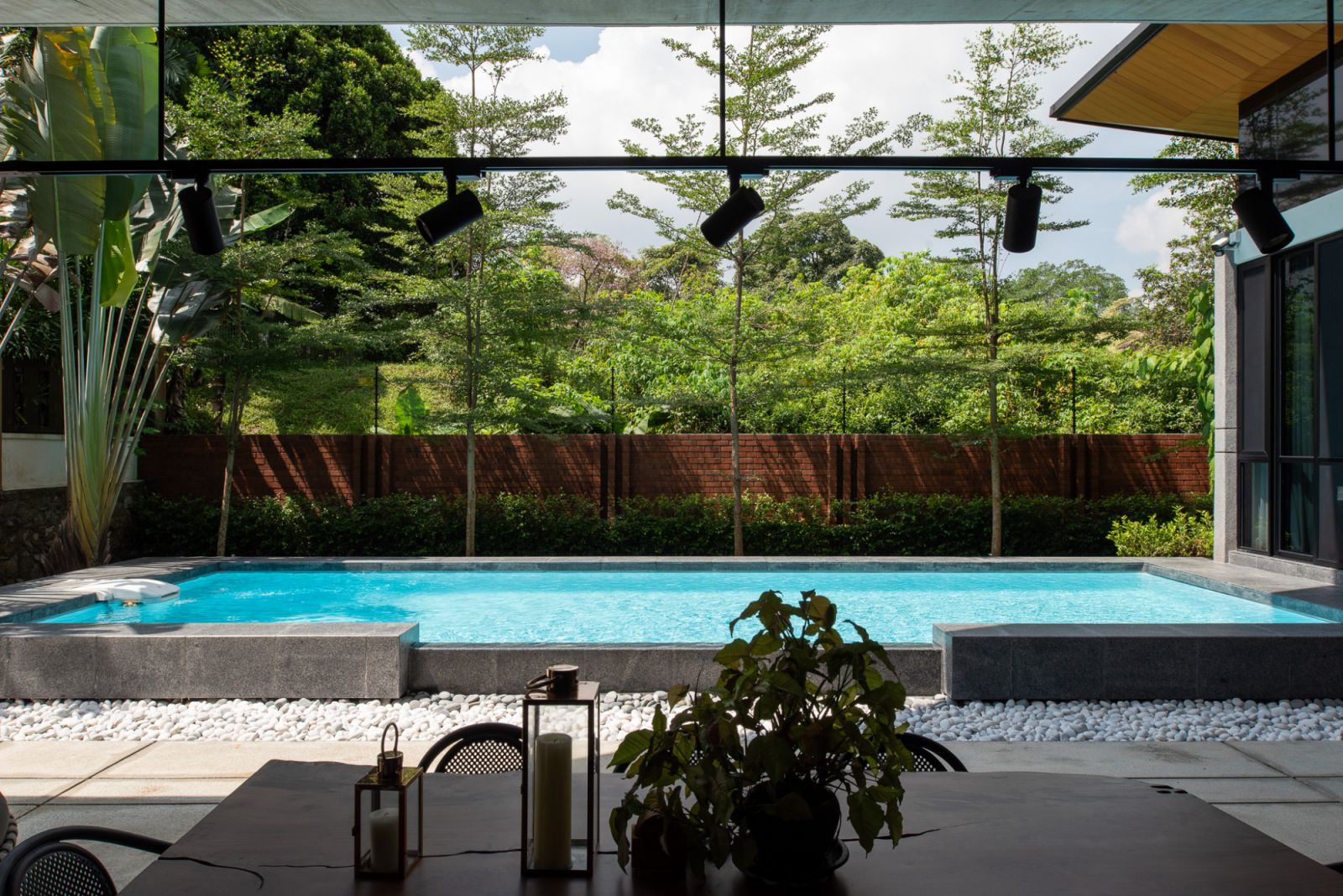 Landscaping adds to the home’s tropical feel