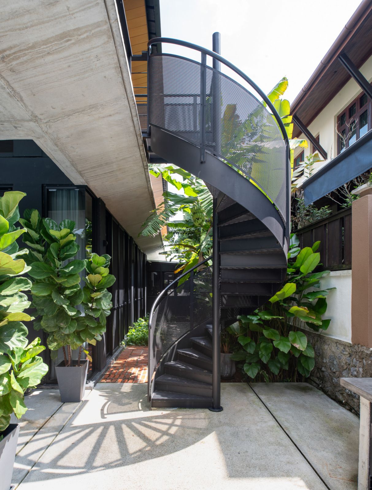 A spiral staircase leads up to the mezzanine floor