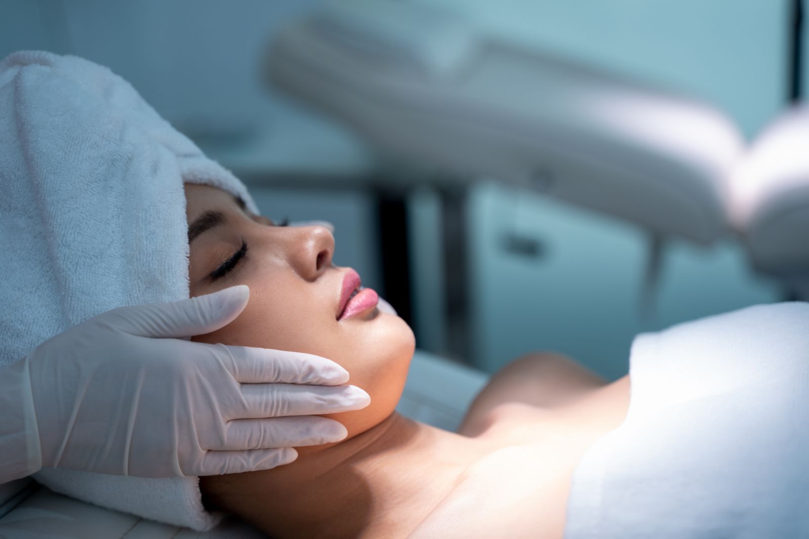 The female dermatologist do face massage to beautiful girl cosmetology cabinet or beauty clinic,Model,Profile,Cosmetological clinic,Patient,Healthcare,Clinic,Cosmetology.