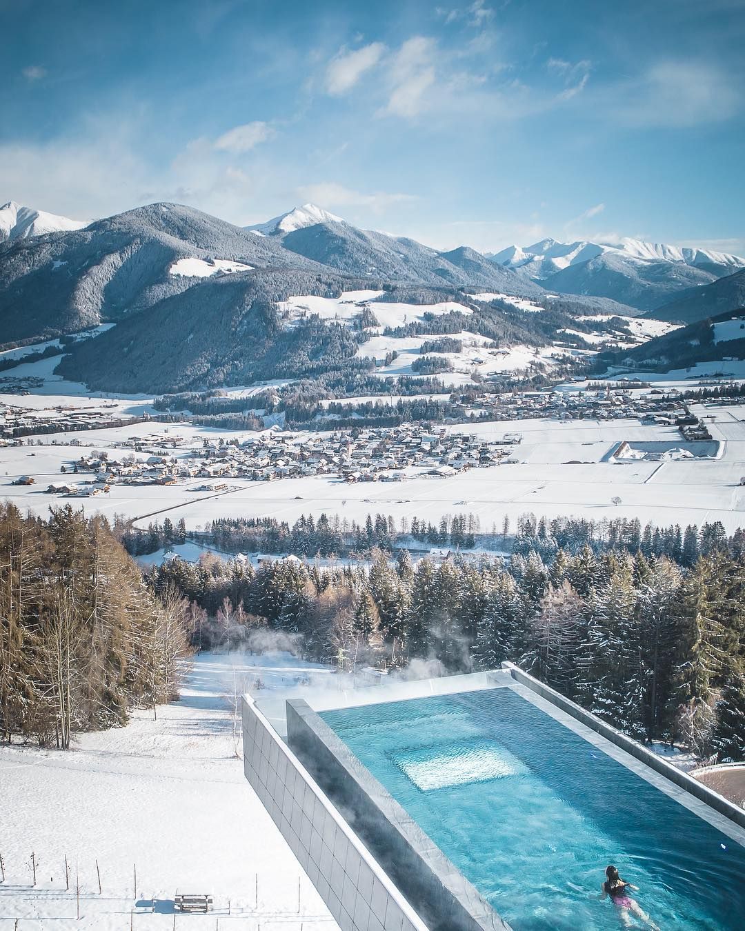The borderless cantilevered swimming pool hovering 12 metres above the ground (Photo: Instagram / @hotel_hubertus)