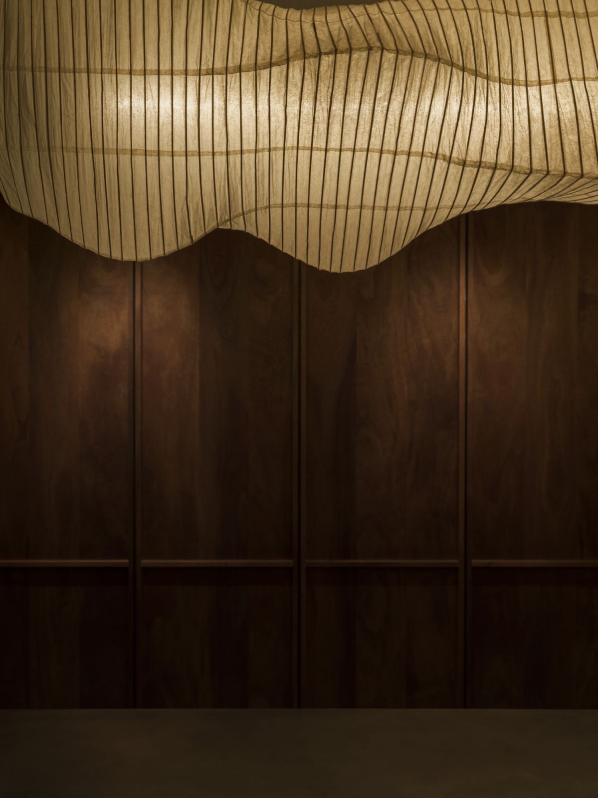 The lantern lighting casts an atmospheric glow (Photo: Saint Laurent)