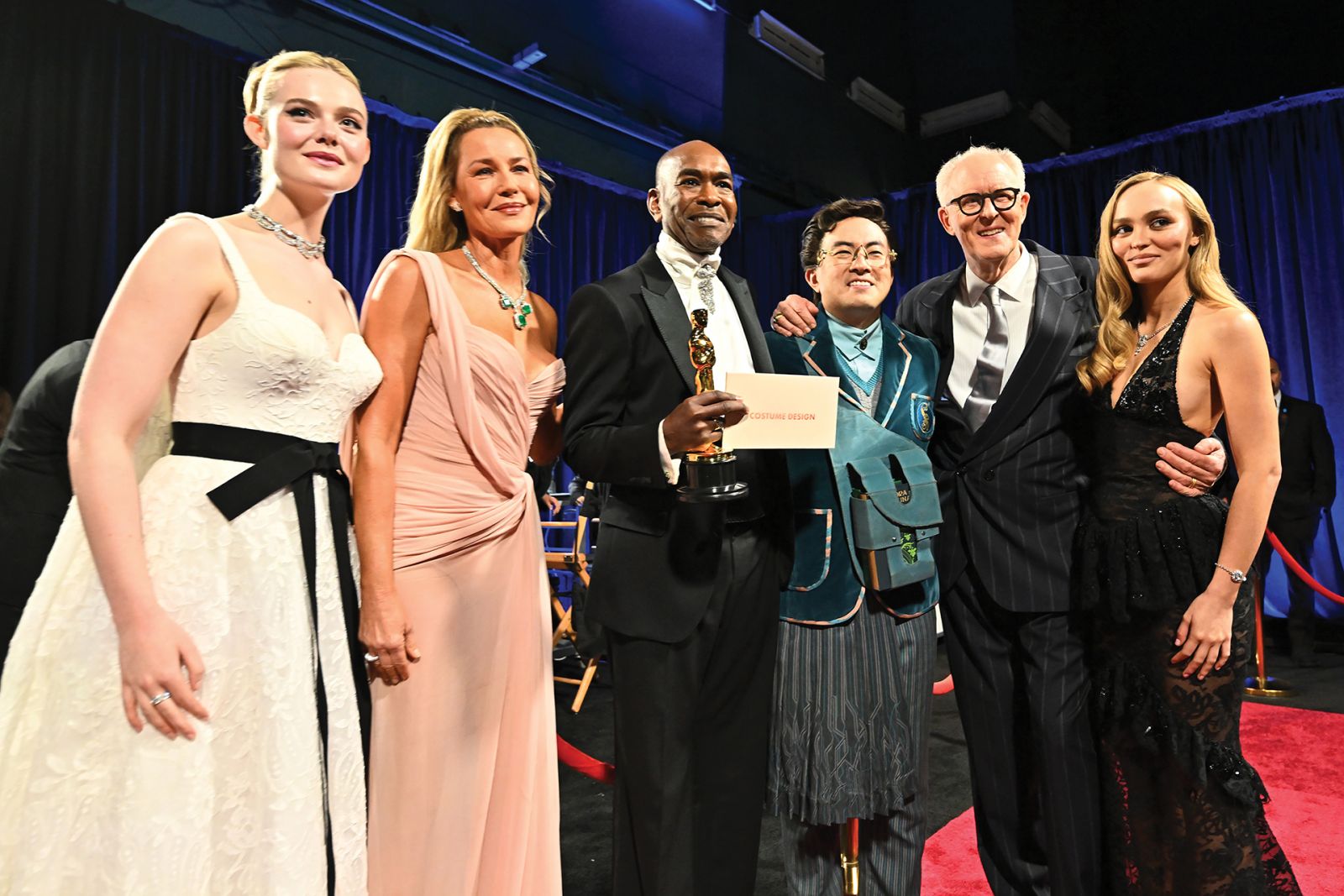 HOLLYWOOD, CALIFORNIA - MARCH 02: In this handout photo provided by The Academy, (L-R) Elle Fanning, Connie Nielsen, Paul Tazewell, Bowen Yang, John Lithgow, and Lily-Rose Depp pose backstage during the 97th Annual Oscars at Dolby Theatre on March 02, 2025 in Hollywood, California. (Photo by Richard Harbaugh/The Academy via Getty Images)
