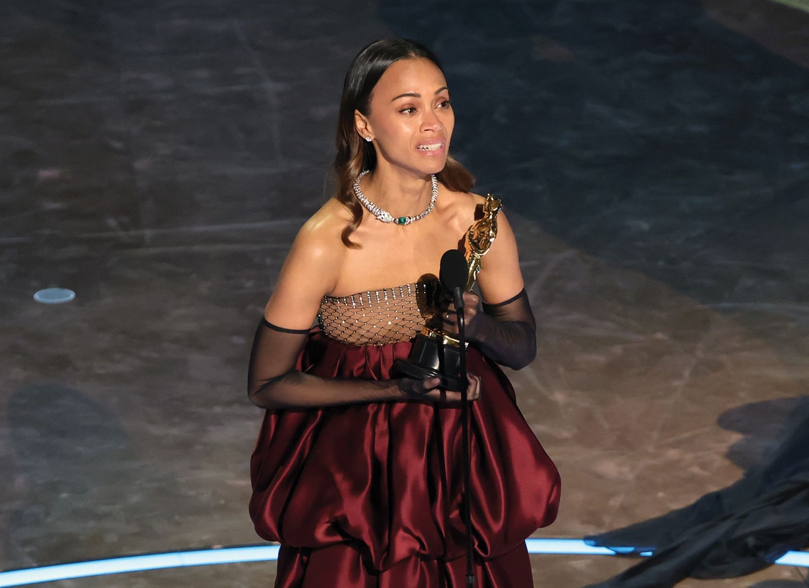HOLLYWOOD, CALIFORNIA - MARCH 02: Zoe Saldana accepts the Best Actress In A Supporting Role award for "Emilia Pérez" onstage during the 97th Annual Oscars at Dolby Theatre on March 02, 2025 in Hollywood, California. (Photo by Kevin Winter/Getty Images)