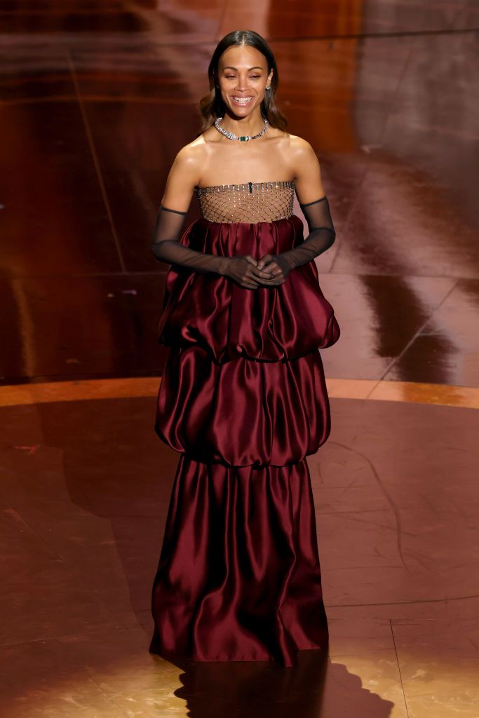 HOLLYWOOD, CALIFORNIA - MARCH 02: Zoe Saldaña speaks onstage during the 97th Annual Oscars at Dolby Theatre on March 02, 2025 in Hollywood, California. (Photo by Kevin Winter/Getty Images)